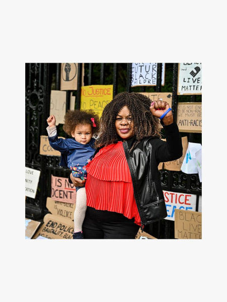 Equal Justice Initiative Donation with woman and child holding their fist up on a light gray background